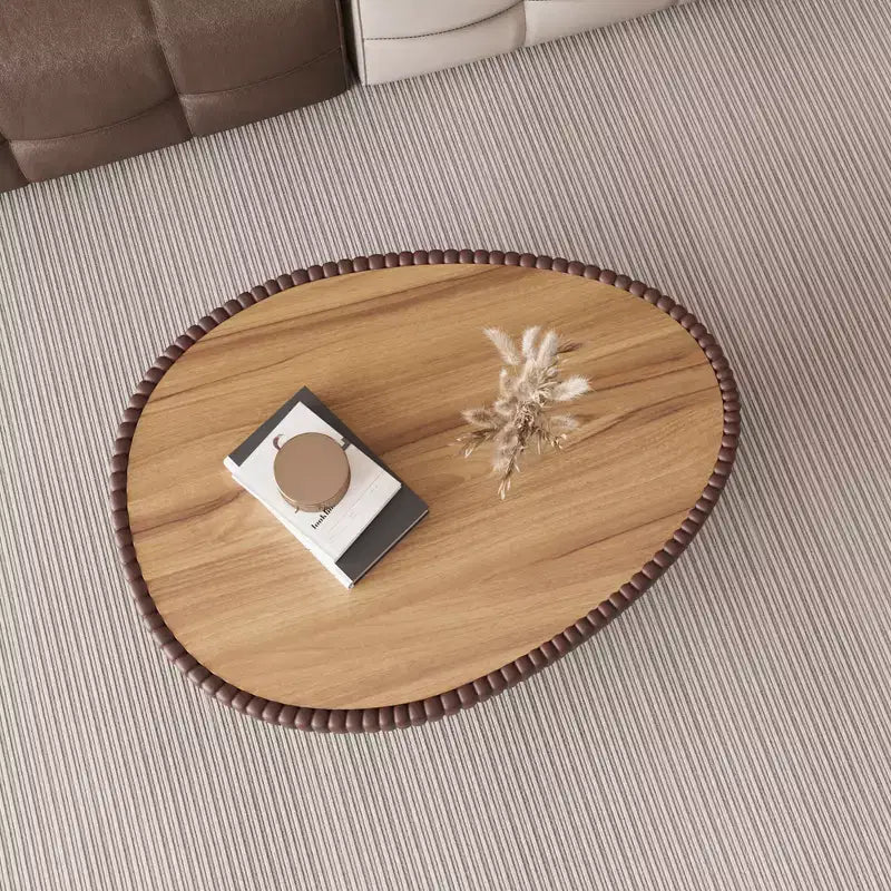 Table basse en cuir en forme d'œuf d'oie avec plateau en pierre frittée et motif unique
