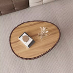 Table basse en cuir en forme d'œuf d'oie avec plateau en pierre frittée et motif unique